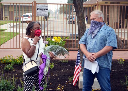 Nancy Tolbert and Steve Speake at Friday's re-dedication of the Otis Vncent Tolbert Memorial at Lemoore High School.